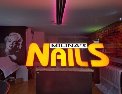 Storefront signs by Harbor GraphX