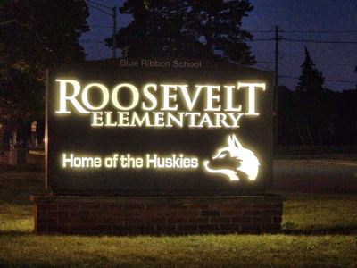 Storefront signs by Harbor GraphX